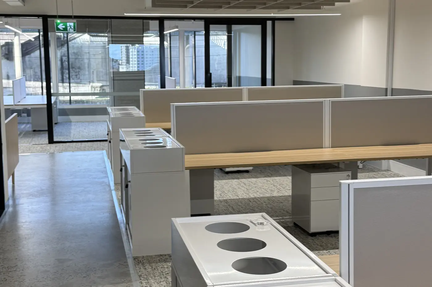 Workstations and bins on a cleaned open plan office floor